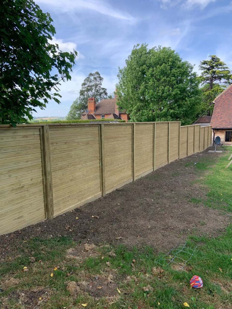 This is a photo of an acoustic fence installed by Fast Fix Fencing Impington